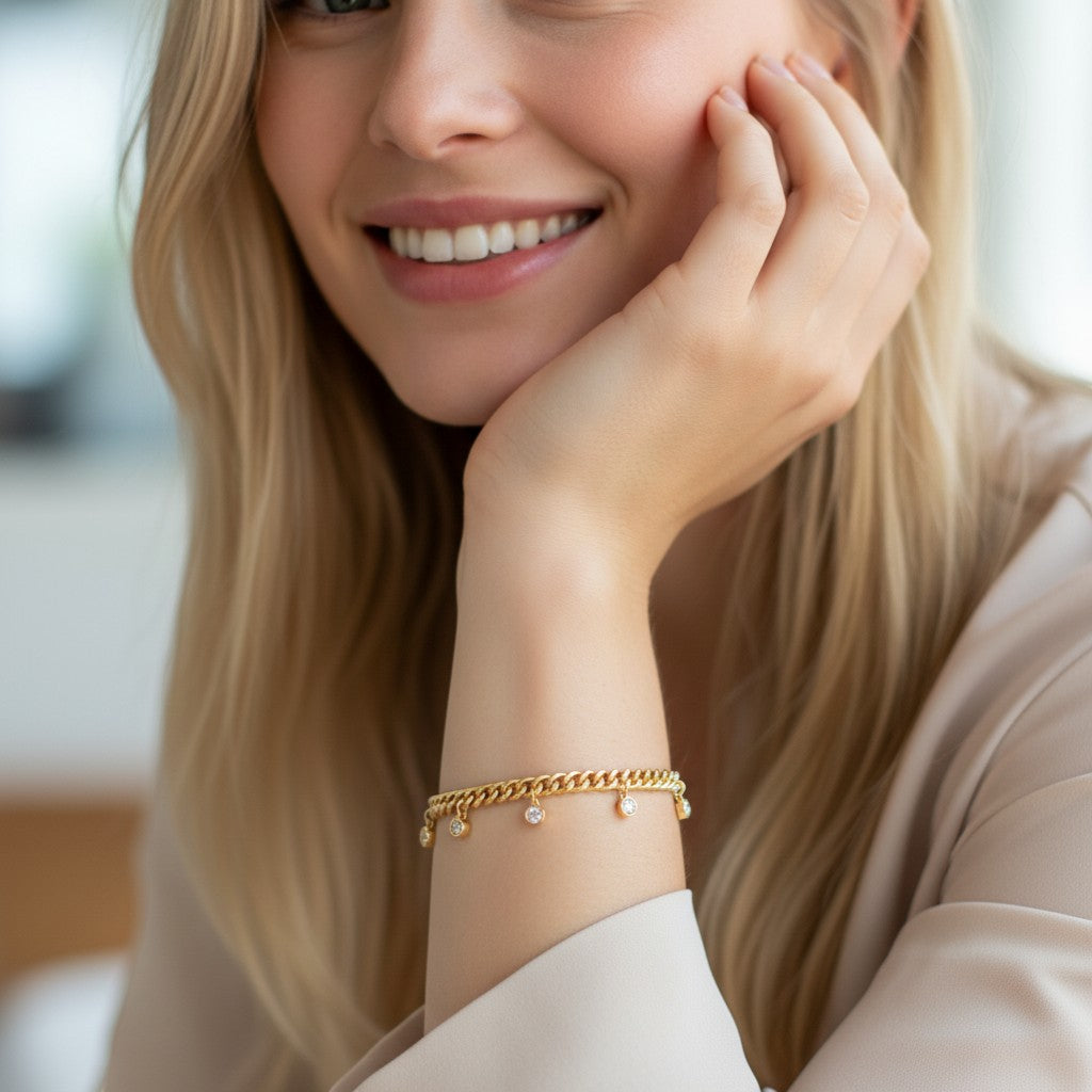 Perlizia gold-plated S925 sterling silver Cuban link bracelet with five bezel-set moissanite charms.