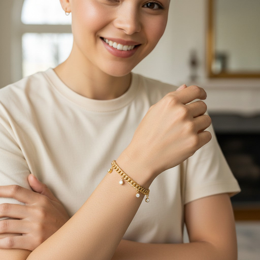 Perlizia gold-plated S925 sterling silver Cuban link bracelet with five bezel-set moissanite charms.