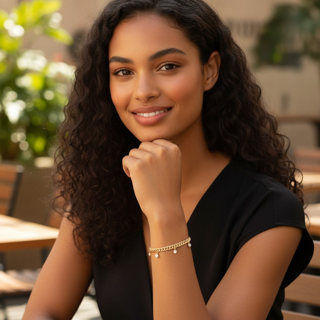 Perlizia gold-plated S925 sterling silver Cuban link bracelet with five bezel-set moissanite charms.