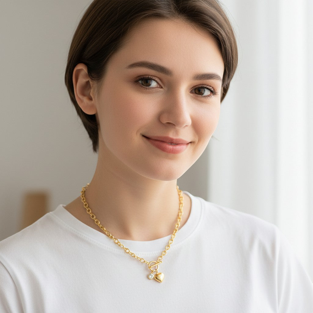 Perlizia gold plated S925 sterling silver toggle necklace with a heart charm and a 1ct moissanite stone.