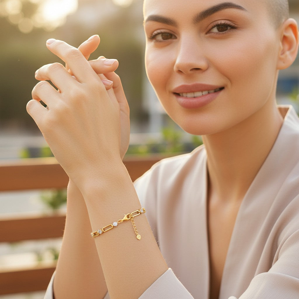 Perlizia gold-plated S925 sterling silver paperclip bracelet with 0.3ct moissanite stones and heart tag.