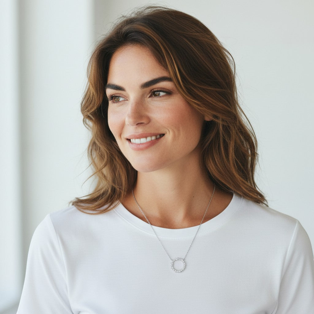 Perlizia platinum-plated sterling silver necklace with a circle of moissanite stones, symbolizing eternal life.
