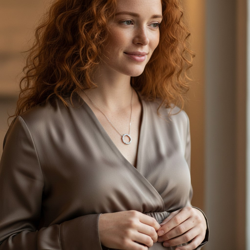 Perlizia platinum-plated sterling silver necklace with a circle of moissanite stones, symbolizing eternal life.