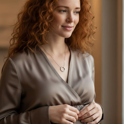 Perlizia platinum-plated sterling silver necklace with a circle of moissanite stones, symbolizing eternal life.