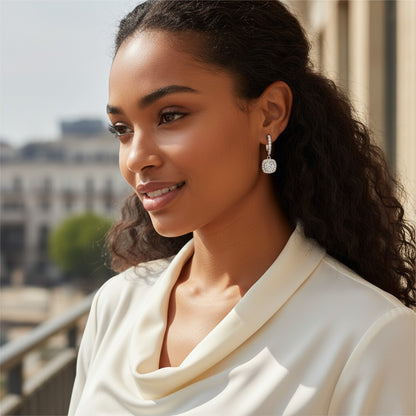 Perlizia platinum-plated S925 silver drop earrings with 0.5ct moissanite center stone and halo.