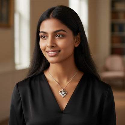 Perlizia 1ct Moissanite double heart pendant necklace in platinum-plated sterling silver with pavé-set outer heart.