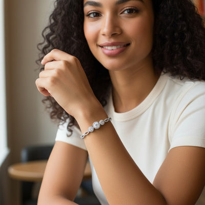 Perlizia 1-carat moissanite tennis bracelet with triple halo center and infinity links, platinum-plated sterling silver.