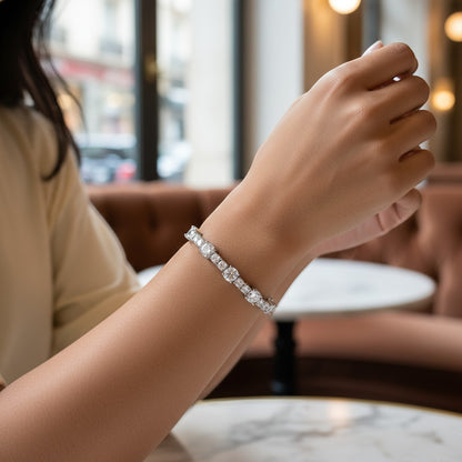 Perlizia Sterling Silver Moissanite Tennis Bracelet with platinum plating and secure clasp. Features round and square cut stones.