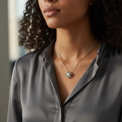 Perlizia white gold plated love knot necklace with cubic zirconia, presented in a gift box with a heartfelt message for Mom.